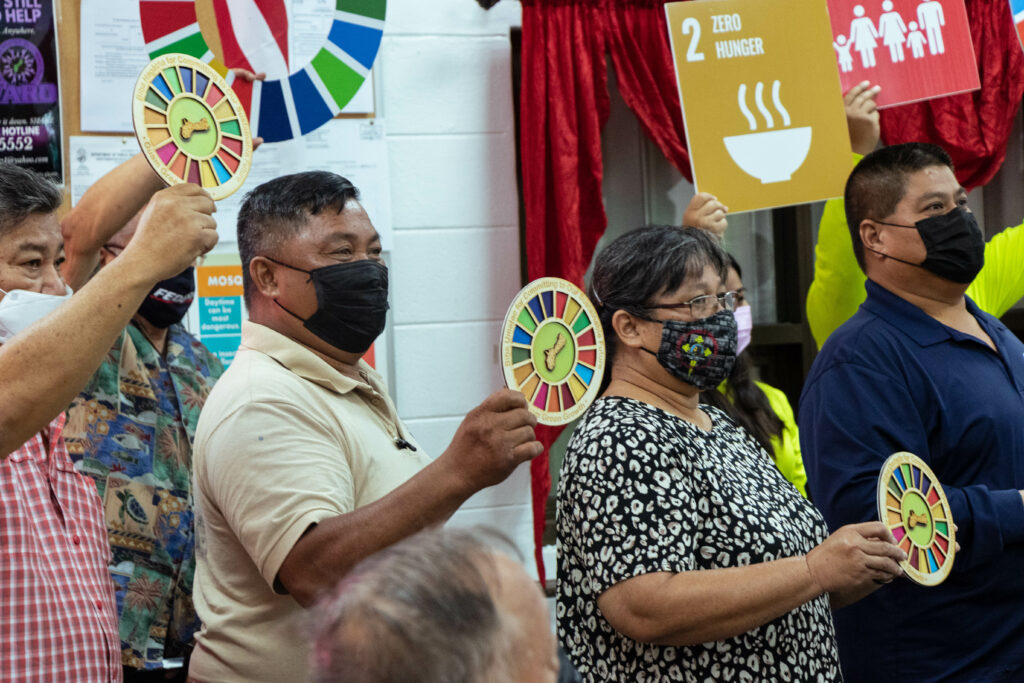 Mayors holding G3 Commitment badges they were awarded