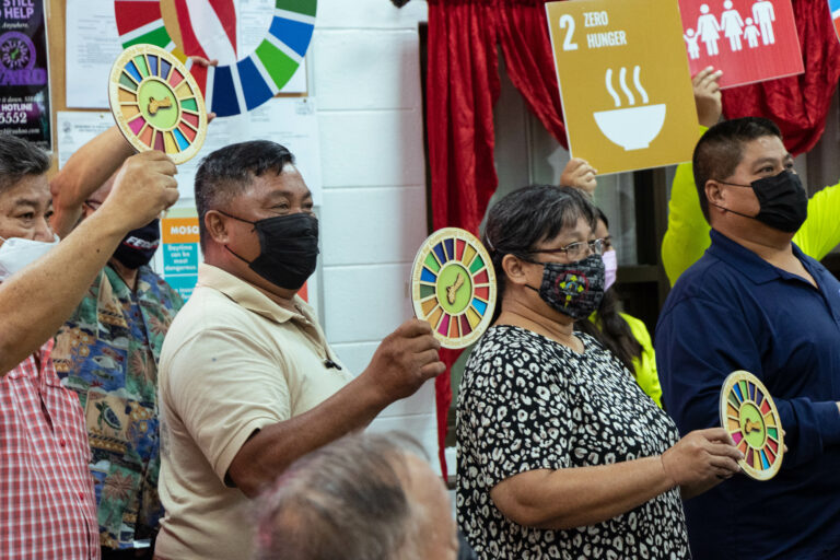 Mayors holding G3 Commitment badges they were awarded
