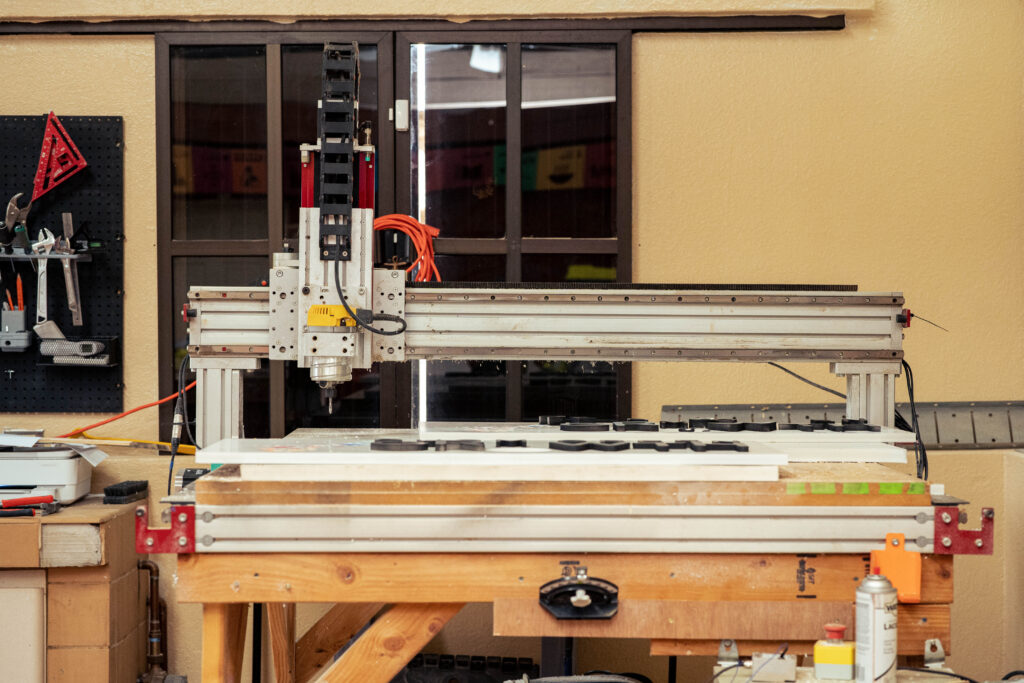 A computer numerical control (CNC) router is displayed in the Guam Green Growth Circular Economy Makerspace and Innovation Hub workshop at the CHamoru Village in Hagåtña, Guam. The CNC router is one of many machines available for entrepreneurs and creators to transform waste into marketable products in Guam’s emerging green economy.