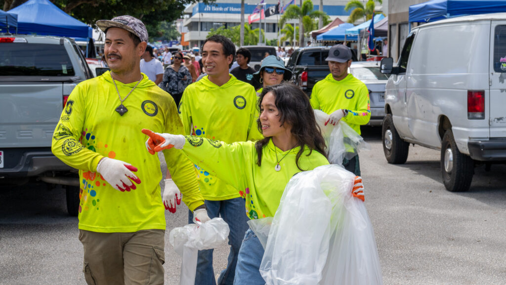 Eyana Pereda points out a can bin to other members of G3CC.