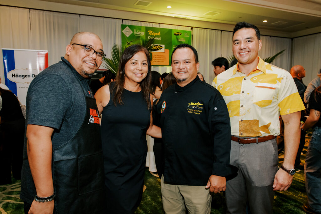 The UOG Center for Island Sustainability and Sea Grant team joins Micronesian Chefs' Association President Peter Duenas at the Maila Ta Fan Chesa event in September at the Hyatt Regency Guam. Pictured with Duenas are Kyle Mandapat, associate director for communications and community engagement; Fran Castro, associate director for operations and development; and Austin Shelton, Ph.D., director.
