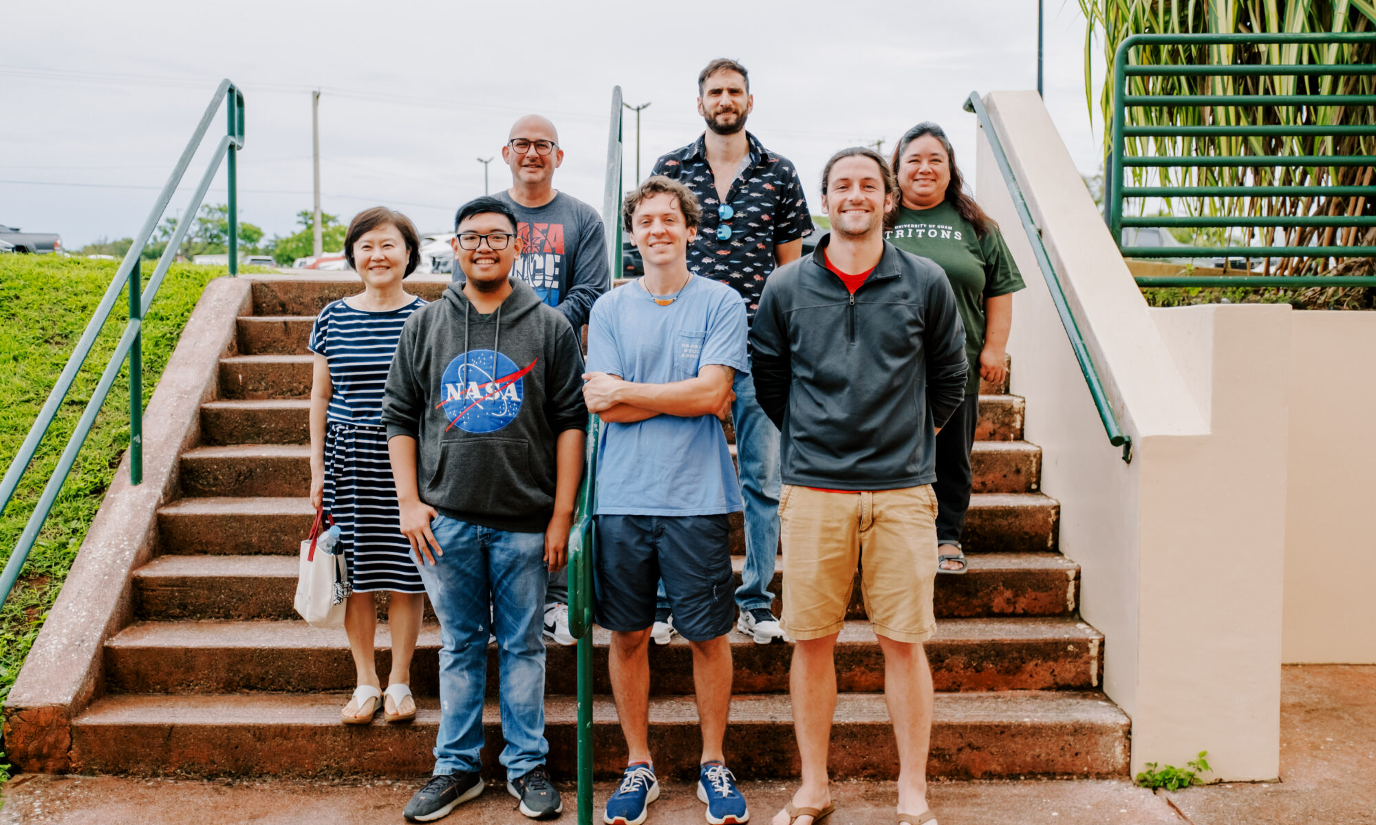 UOG NSF EPSCoR E-RISE's first graduate research assistant cohort with their faculty mentors. Front row L-R: Mark Galang, Alex Loria, and Joe Epler. Back row L-R: Dr. Hyunjin Oh, Dr. Bastian Bentlage, Dr. Michalis Mihalitsis, and Dr. Leslie Aquino. Not pictured: EPSCoR E-RISE GRA Robert Babac and faculty mentor Dr. Joo-Chul Yoon.