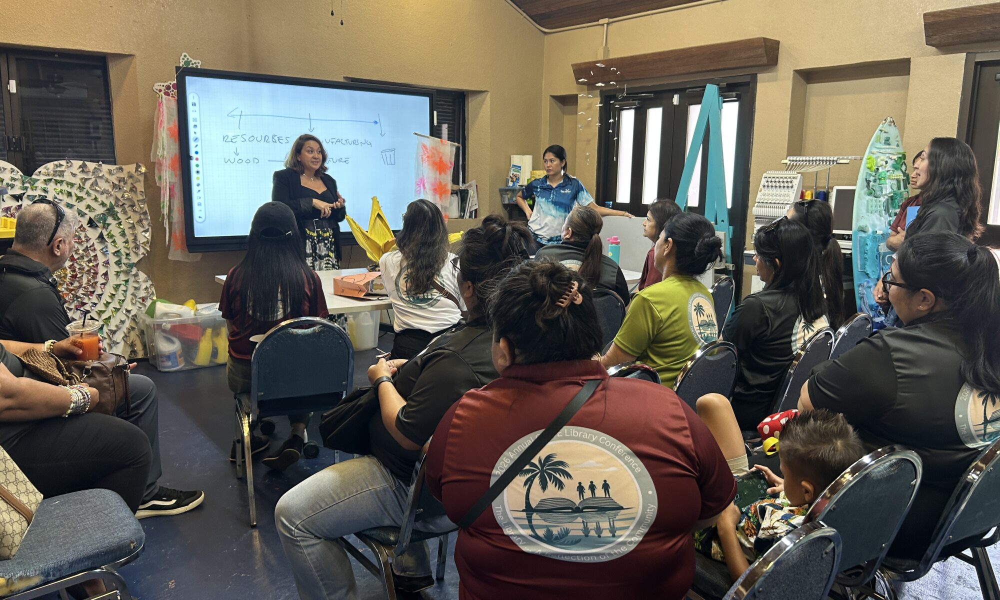 G3 Makerspace Circular Economy Coordinator Abby Crain, with support from Circular Economy Education Assistant Francesca De Oro, provides an overview of the G3 Makerspace and Innovation Hub during a visit by Guam Department of Education school librarians. The librarians toured the facility at the CHamoru Village in February as part of the 2026 GDOE Annual Library Conference.
