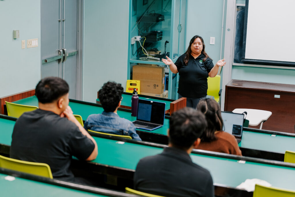 Leslie Aquino, Ph.D., a mathematics professor at the University of Guam welcomes students during the program orientation.