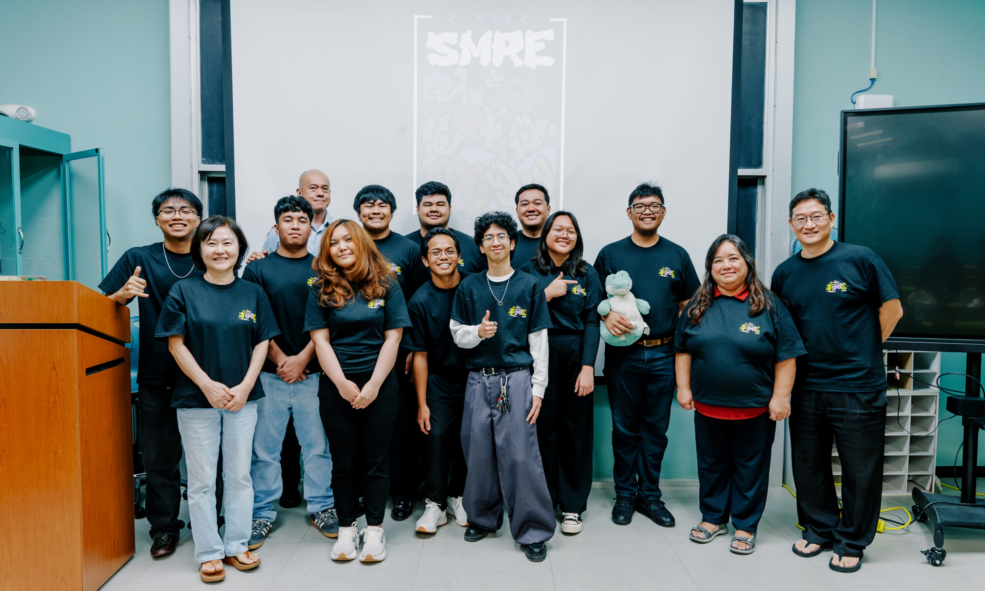 The 2026 Summer Math Research Experience (SMRE) cohort and mentors gather following the program's final presentations at the University of Guam.